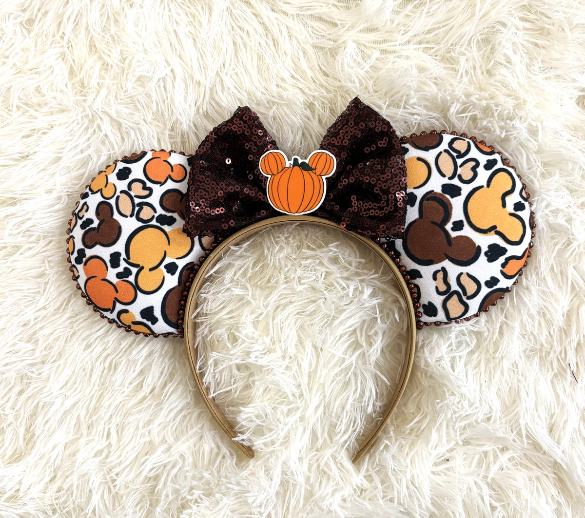 Handcrafted Harvest Mouse Magic Signature mouse ear headband featuring colorful autumn mouse silhouettes, copper-brown beaded trim, an oversized chocolate-brown sequin bow, and a mouse-shaped pumpkin centerpiece.