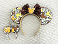 Handcrafted Harvest Mouse Magic Pixie Pair featuring autumn mouse-patterned Signature ears with a chocolate-brown sequin bow and pumpkin centerpiece, plus a matching miniature ear bag charm with a golden-orange bow.