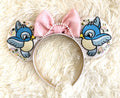 Handcrafted Enchanted Helpers mouse ear headband with embroidered blue songbirds, pastel floral details, pearl-beaded trim and soft pink sequin bow.